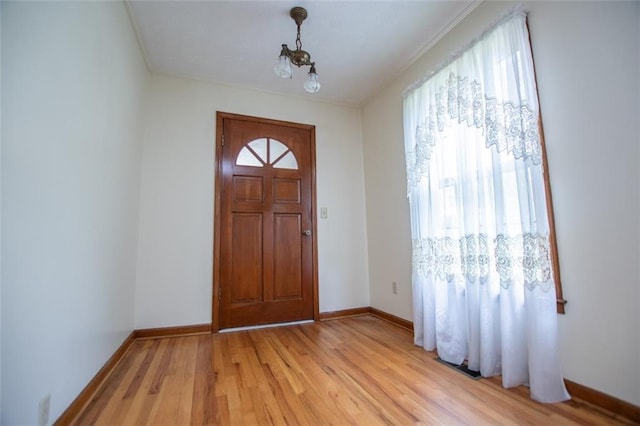 entrance foyer featuring plenty of natural light and light wood-type flooring