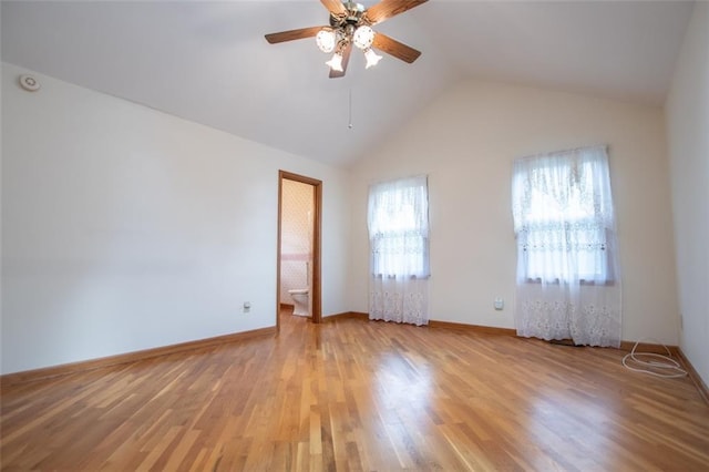 unfurnished room featuring wood-type flooring, lofted ceiling, and ceiling fan