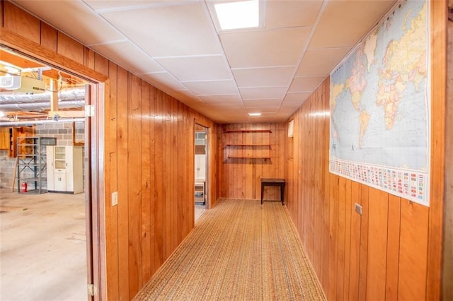 hallway with wood walls