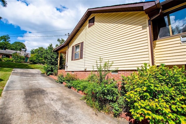 view of side of home featuring a patio area