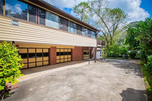 view of side of property with a garage