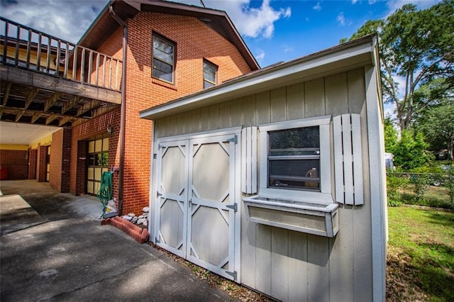 exterior space with a carport and a shed