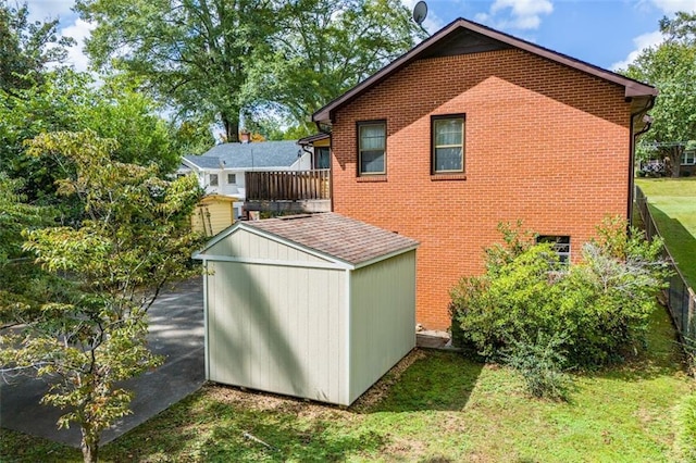 view of outdoor structure featuring a lawn