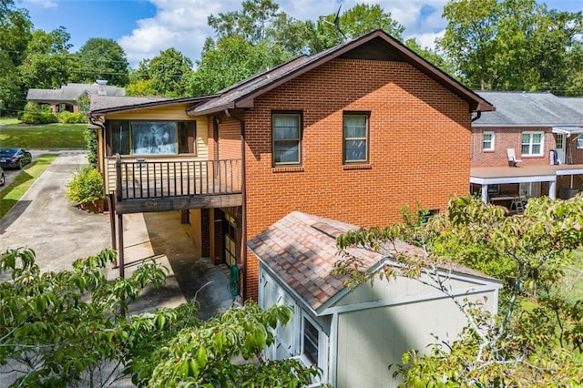 back of property featuring a carport