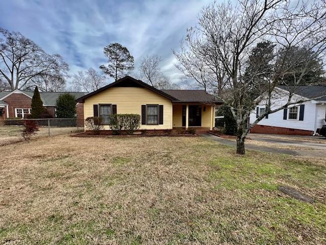 ranch-style house with a front yard