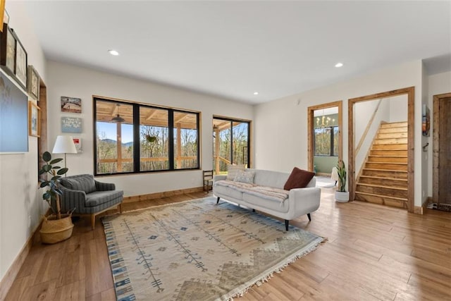 living room featuring a healthy amount of sunlight and light hardwood / wood-style flooring