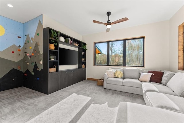 carpeted living room with ceiling fan