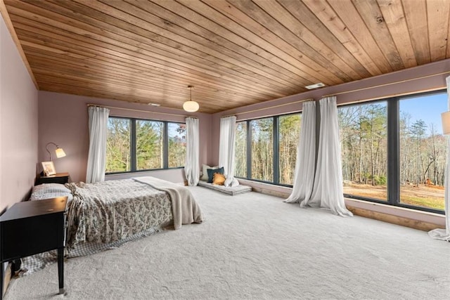 carpeted bedroom featuring wood ceiling