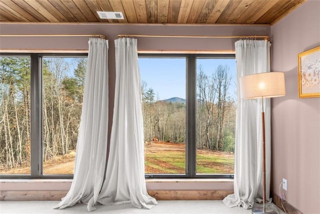 doorway to outside featuring wooden ceiling