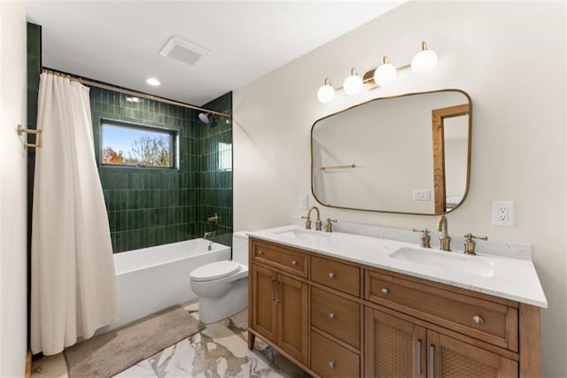 full bathroom with vanity, toilet, and shower / bath combo with shower curtain