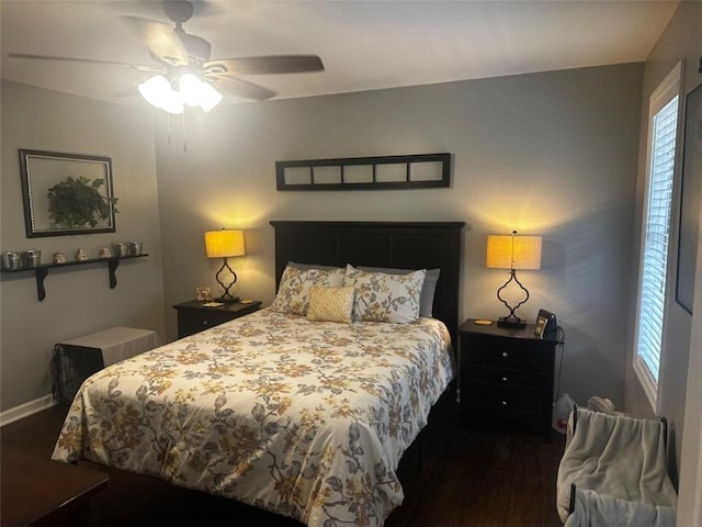 bedroom featuring ceiling fan and dark hardwood / wood-style flooring