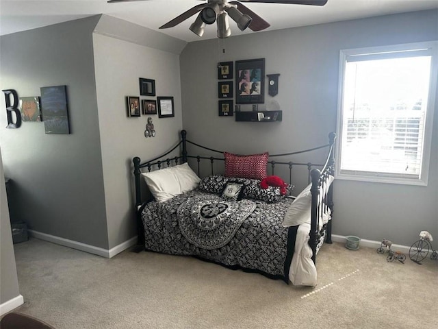 carpeted bedroom with lofted ceiling and ceiling fan