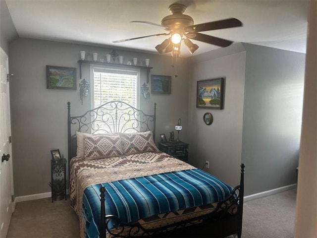 carpeted bedroom with ceiling fan and lofted ceiling