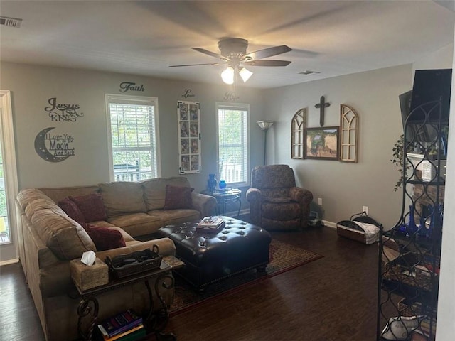 living room with dark wood-type flooring and ceiling fan