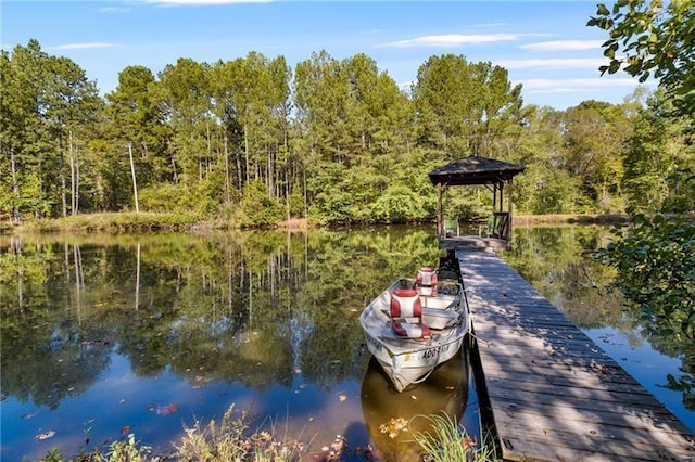 dock area with a gazebo and a water view