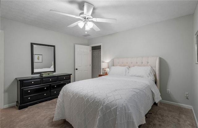 carpeted bedroom featuring ceiling fan