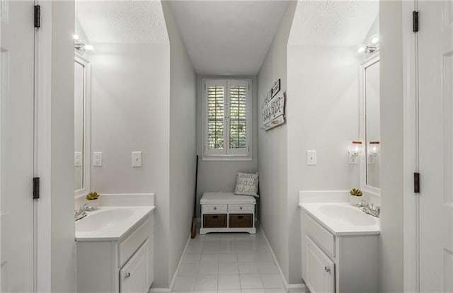 bathroom featuring vanity and a textured ceiling