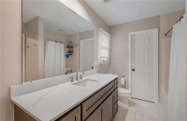 full bathroom with tile patterned floors, vanity, toilet, and shower / tub combo