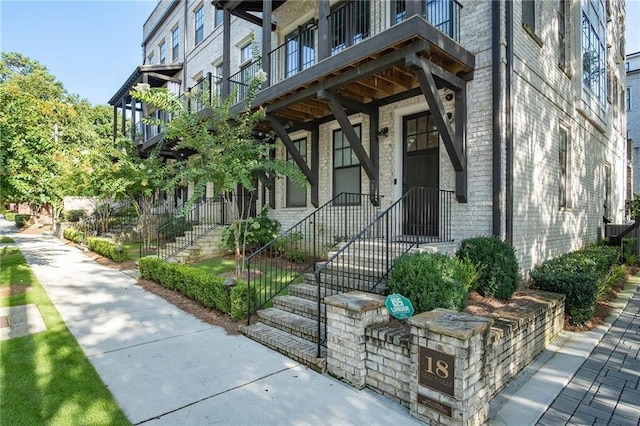 property entrance featuring brick siding