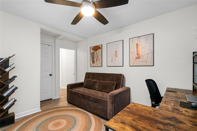 office space with ceiling fan and wood-type flooring