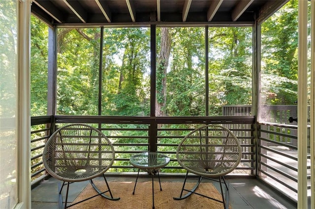 unfurnished sunroom featuring a healthy amount of sunlight