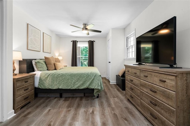 bedroom with ceiling fan and wood-type flooring