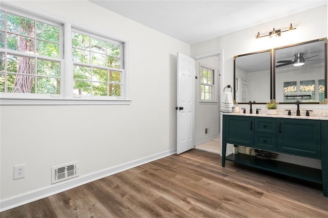 bathroom with vanity, hardwood / wood-style flooring, and ceiling fan