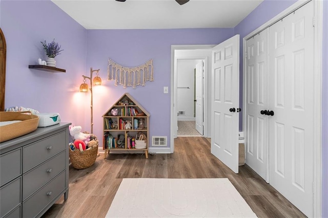 game room with hardwood / wood-style floors