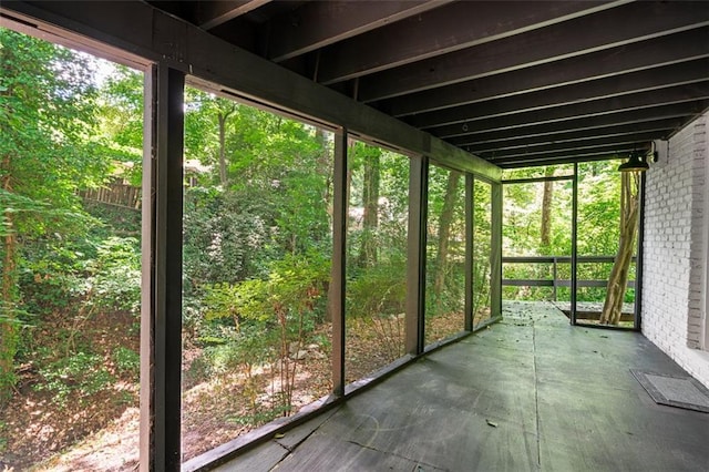 unfurnished sunroom with a healthy amount of sunlight