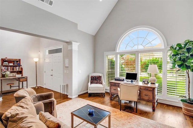 1473 Cardova Pointe, Dunwoody, GA 30338 - living room featuring high vaulted ceiling, wood finished floors, and a desk