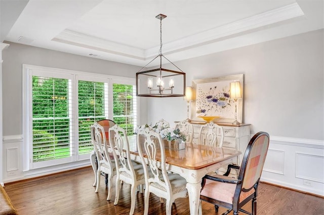 1473 Cardova Pointe, Dunwoody, GA 30338 - dining area with a raised ceiling, a chandelier, crown molding, wood finished floors, and wainscoting
