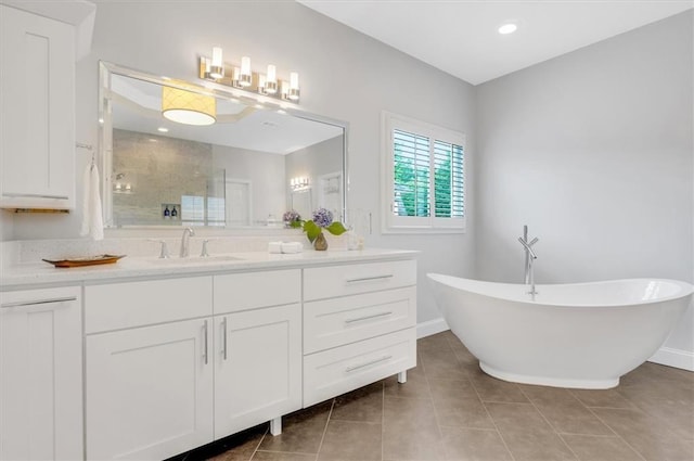 1473 Cardova Pointe, Dunwoody, GA 30338 - bathroom with a shower stall, vanity, a freestanding bath, and tile patterned flooring