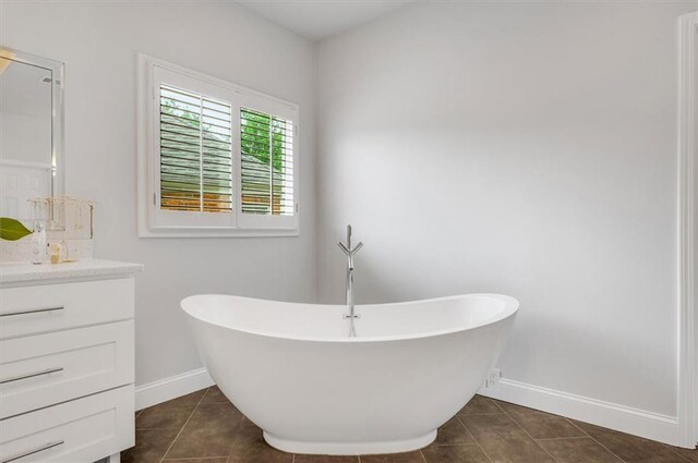 1473 Cardova Pointe, Dunwoody, GA 30338 - bathroom with vanity, a soaking tub, and tile patterned floors