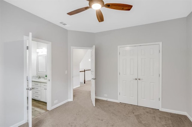 1473 Cardova Pointe, Dunwoody, GA 30338 - unfurnished bedroom featuring light carpet, a closet, ceiling fan, and connected bathroom