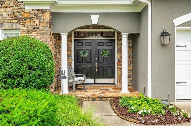 1473 Cardova Pointe, Dunwoody, GA 30338 - doorway to property with stone siding, a porch, and stucco siding