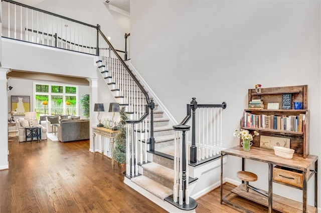1473 Cardova Pointe, Dunwoody, GA 30338 - stairs featuring wood finished floors and a towering ceiling