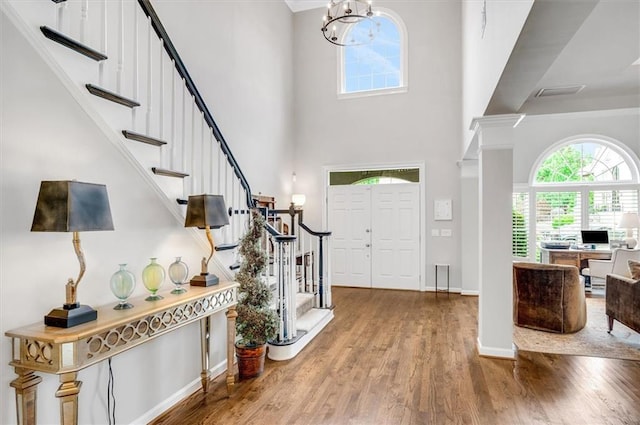 1473 Cardova Pointe, Dunwoody, GA 30338 - entryway featuring a high ceiling, stairway, wood finished floors, and a chandelier