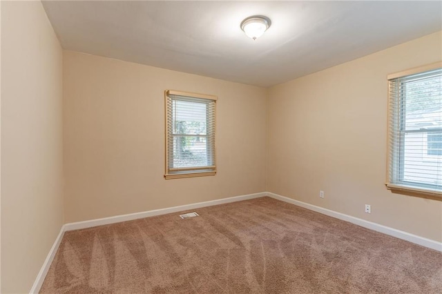 unfurnished room with carpet