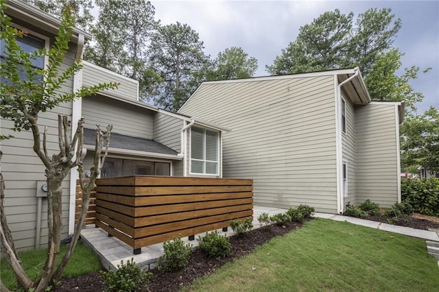 view of home's exterior featuring a lawn