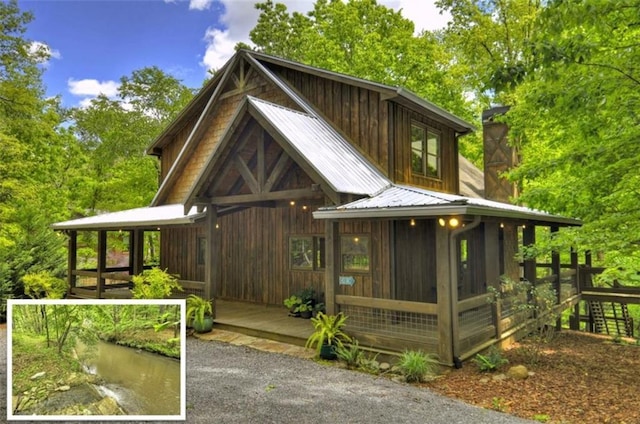 179 Huckleberry Ln, Ellijay, GA 30536 - view of front of property featuring metal roof and a sunroom