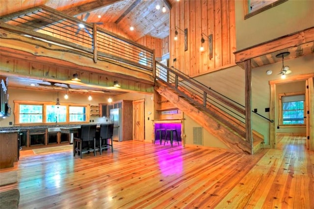 179 Huckleberry Ln, Ellijay, GA 30536 - living area with hardwood / wood-style flooring, high vaulted ceiling, stairs, and beamed ceiling