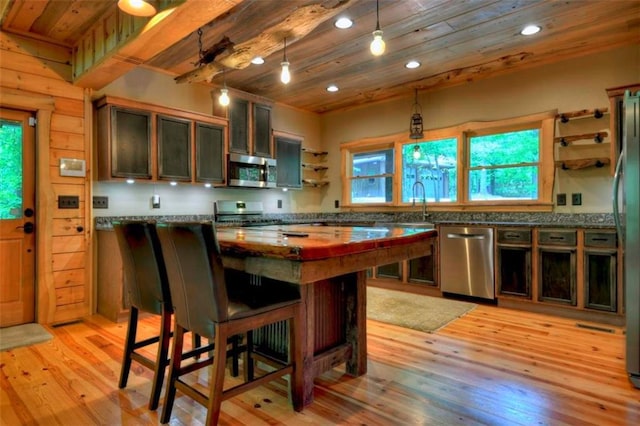 179 Huckleberry Ln, Ellijay, GA 30536 - kitchen featuring appliances with stainless steel finishes, open shelves, wood ceiling, light wood-style floors, and a kitchen breakfast bar