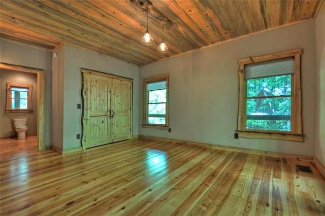 179 Huckleberry Ln, Ellijay, GA 30536 - unfurnished bedroom with multiple windows, wooden ceiling, and hardwood / wood-style flooring