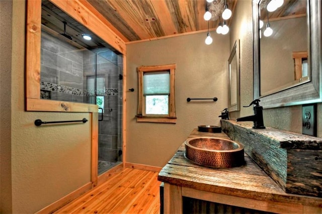 179 Huckleberry Ln, Ellijay, GA 30536 - bathroom with wood finished floors, a tile shower, baseboards, double vanity, and wood ceiling