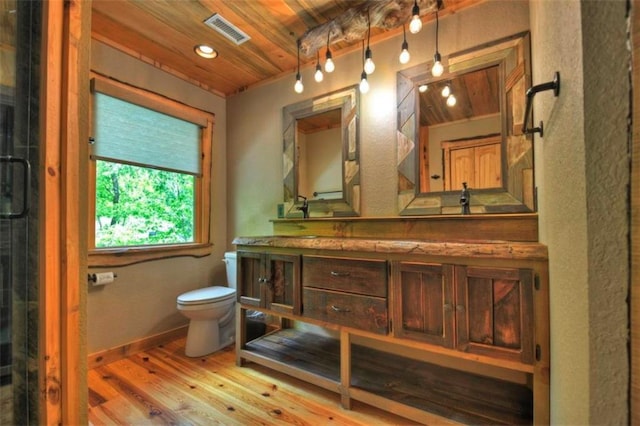 179 Huckleberry Ln, Ellijay, GA 30536 - bathroom featuring toilet, wooden ceiling, wood finished floors, vanity, and baseboards