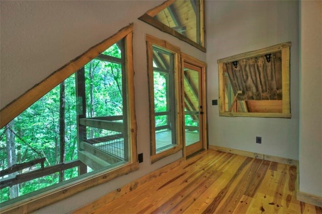 179 Huckleberry Ln, Ellijay, GA 30536 - doorway with wood finished floors, vaulted ceiling, and baseboards