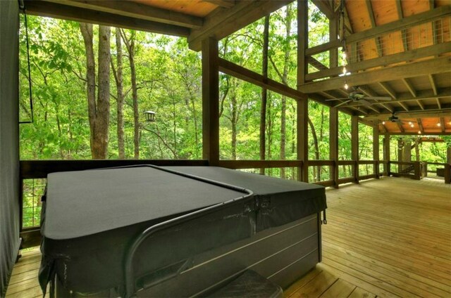 179 Huckleberry Ln, Ellijay, GA 30536 - sunroom with a hot tub, ceiling fan, and a wooded view