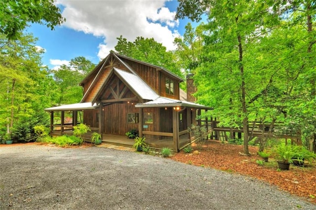 179 Huckleberry Ln, Ellijay, GA 30536 - rustic home featuring a chimney, a sunroom, and metal roof
