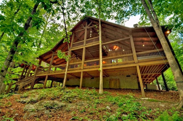 179 Huckleberry Ln, Ellijay, GA 30536 - back of property featuring crawl space and a wooden deck