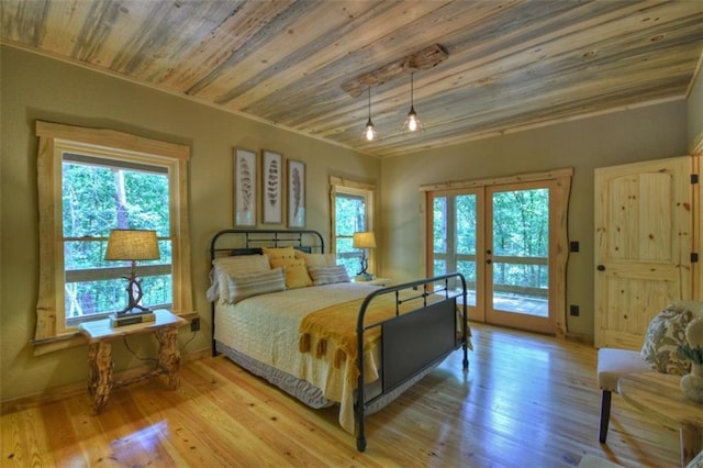 179 Huckleberry Ln, Ellijay, GA 30536 - bedroom with wood finished floors, wooden ceiling, baseboards, and french doors